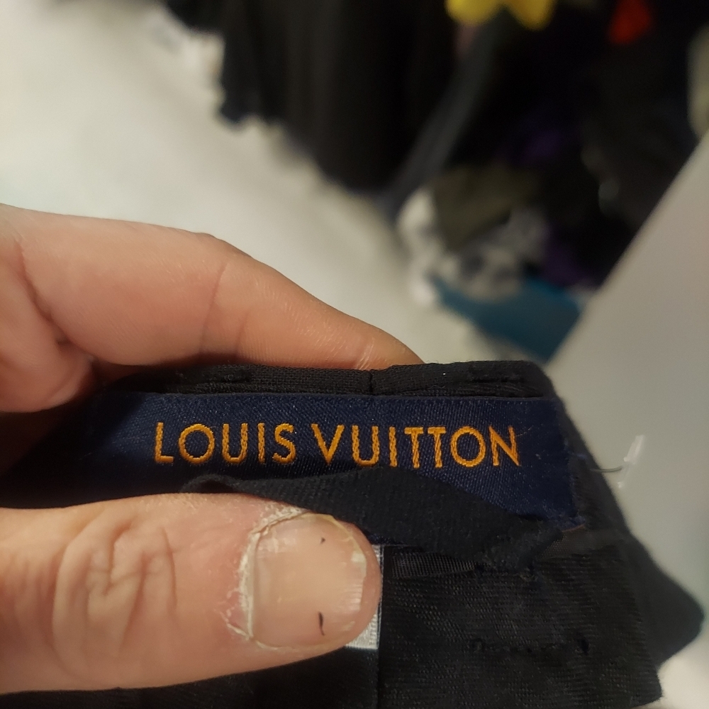 Trending designer pleated trousers. Louis Vuitton pants.